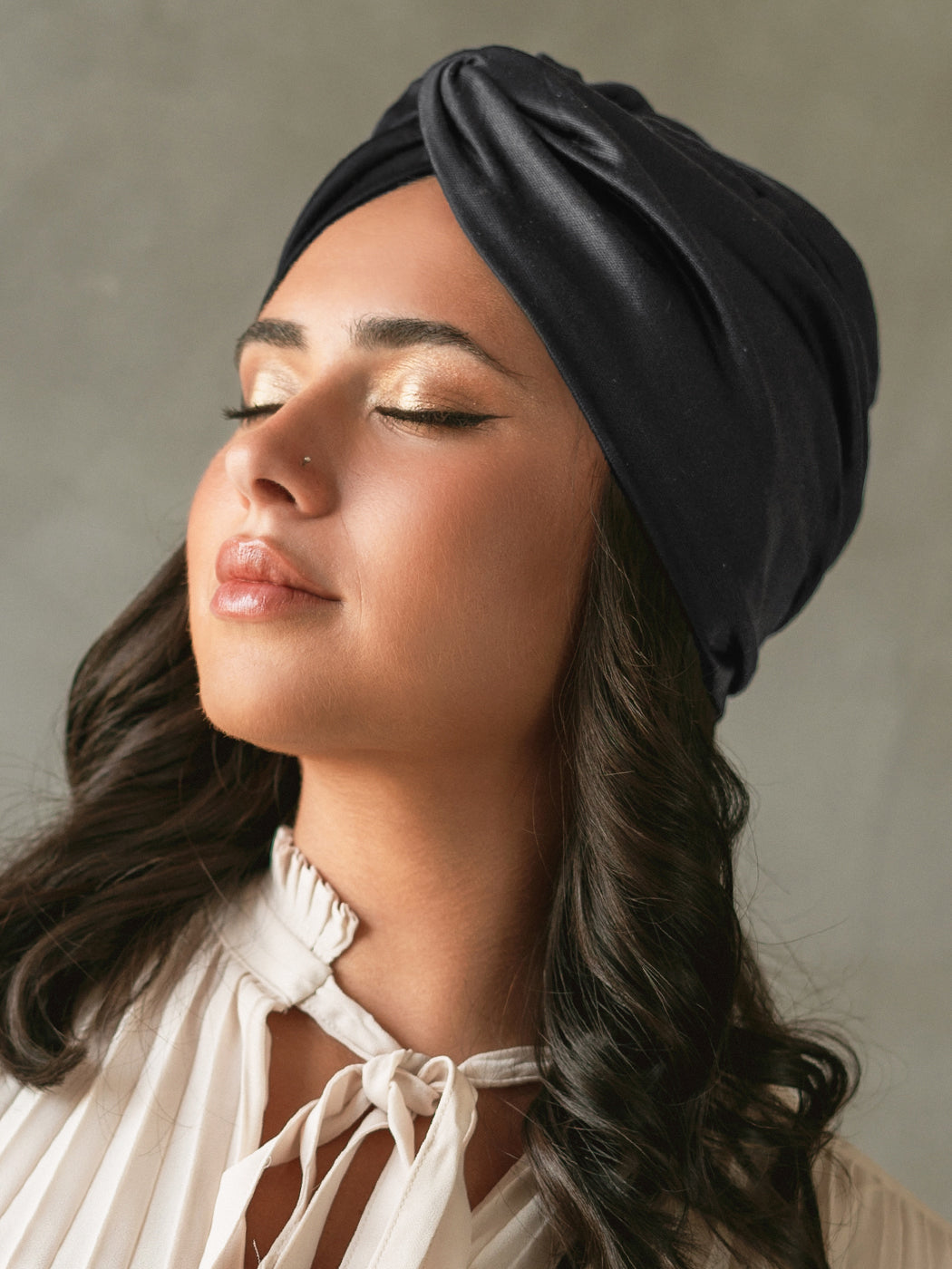 Black satin lined head wrap turban for women made from luxe fabrics to protect your hair. 